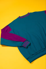vintage teal and purple crewneck on a yellow background