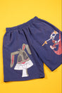 A pair of navy blue shorts featuring a large graphic of Bugs Bunny on the front and a smaller graphic of Looney Tunes characters on the side, displayed flat against a solid yellow background.